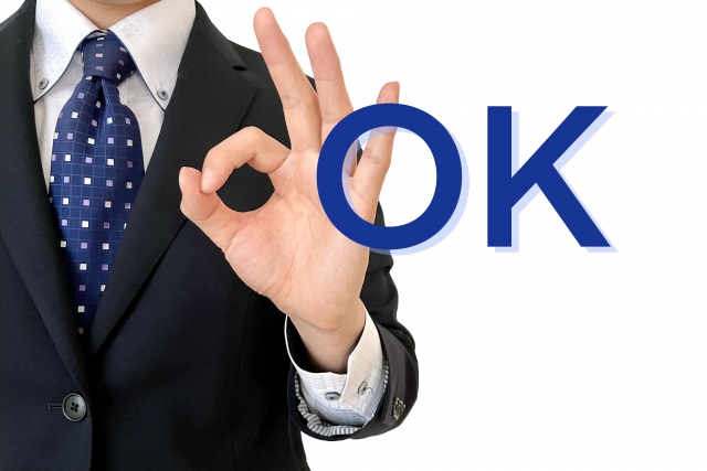 ＯＫサインするセールスマン